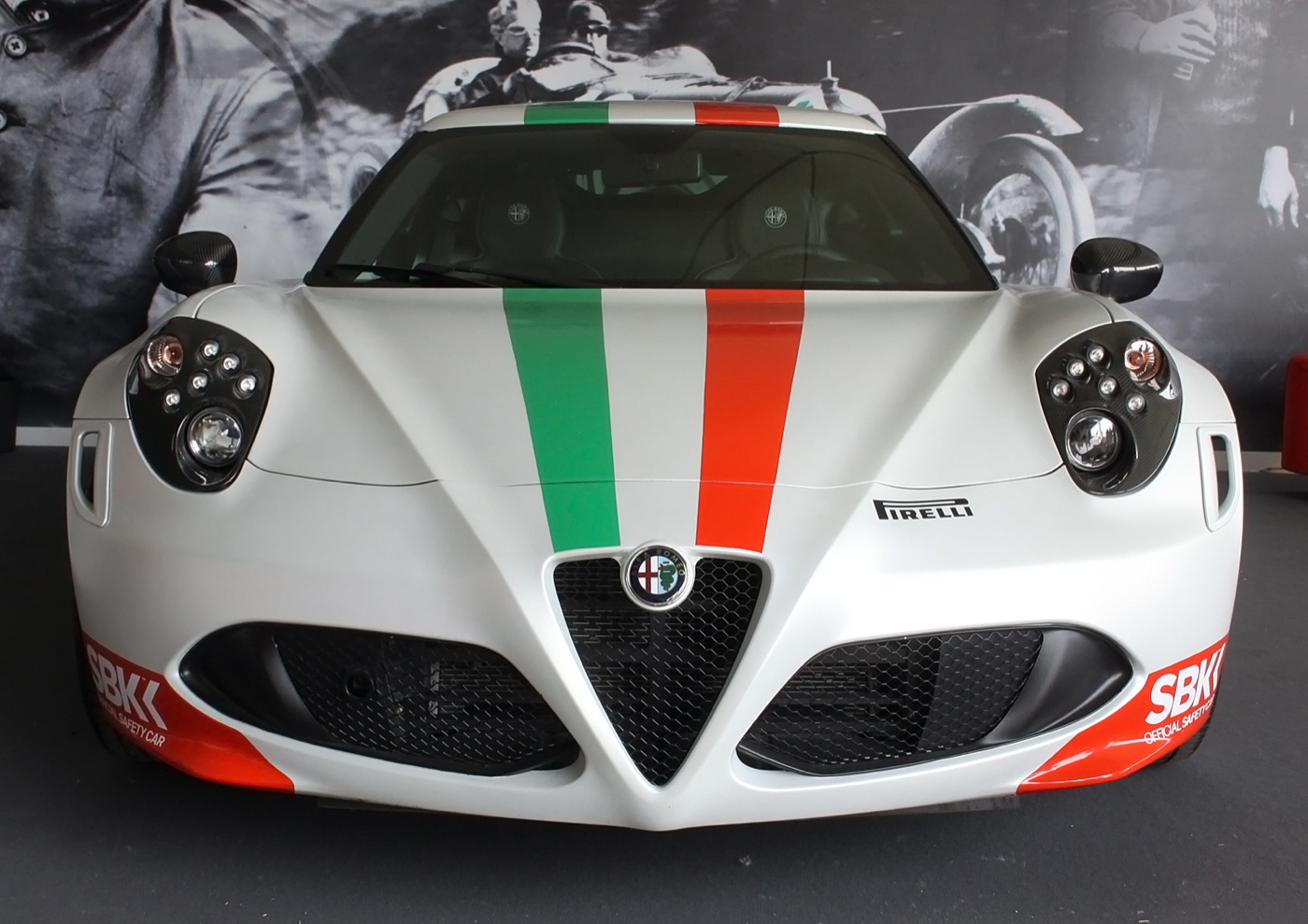 White Alfa Romeo 4C from the front with green and red stripes and Superbike safety car lettering