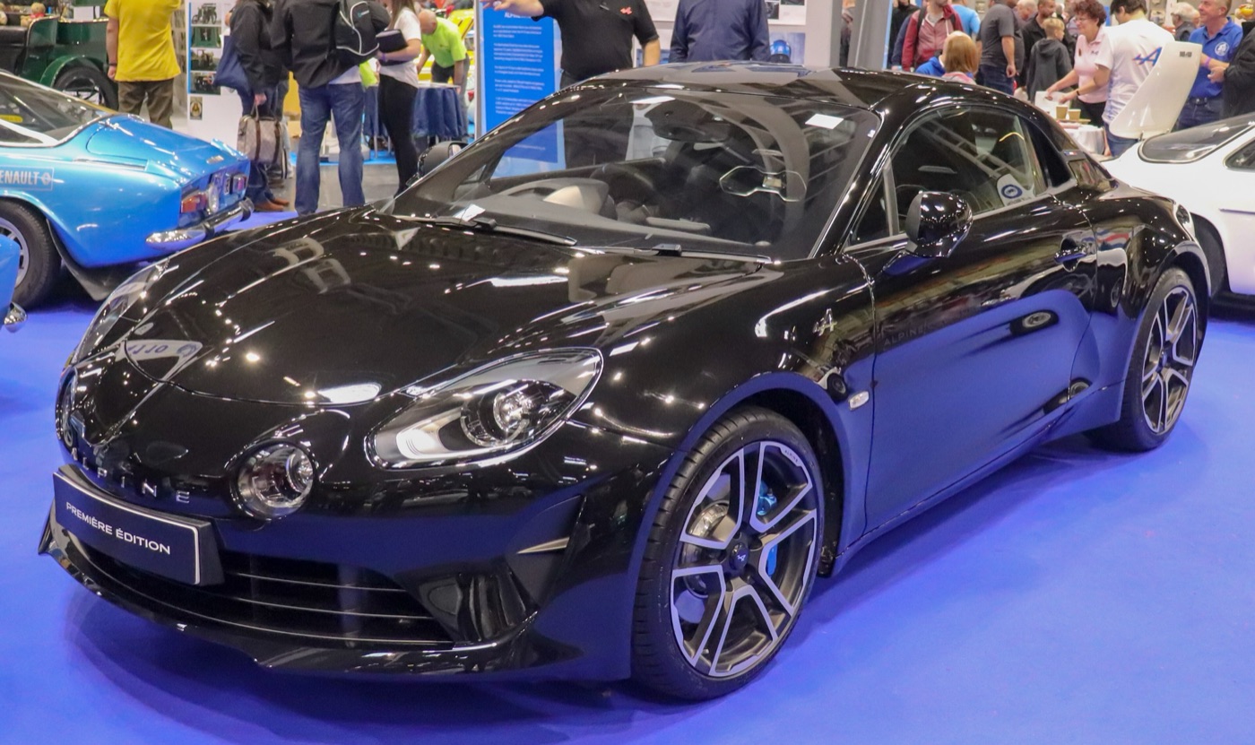 Black Alpine A110 Premiere Edition coupé on a show stand