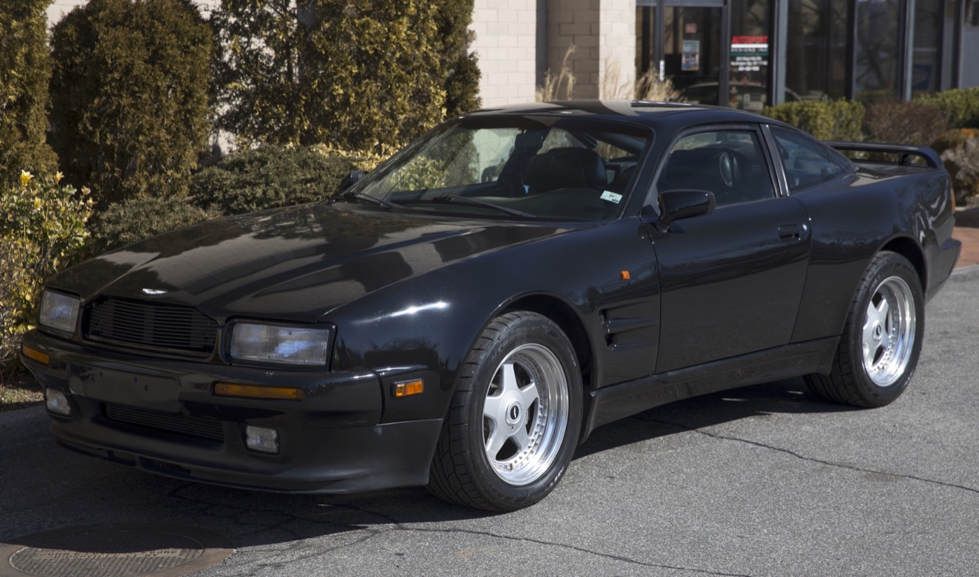 Black 1991 Aston Martin Virage 6.3 Widebody coupe with flared wheel arches, wing vents and five-spoke wheels