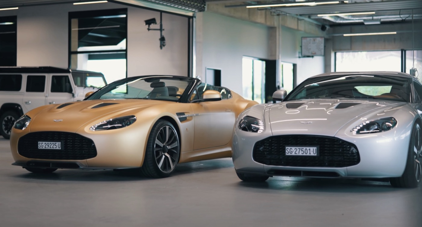 A gold V12 Zagato Speedster and a silver V12 Zagato coupé side by side in a showroom