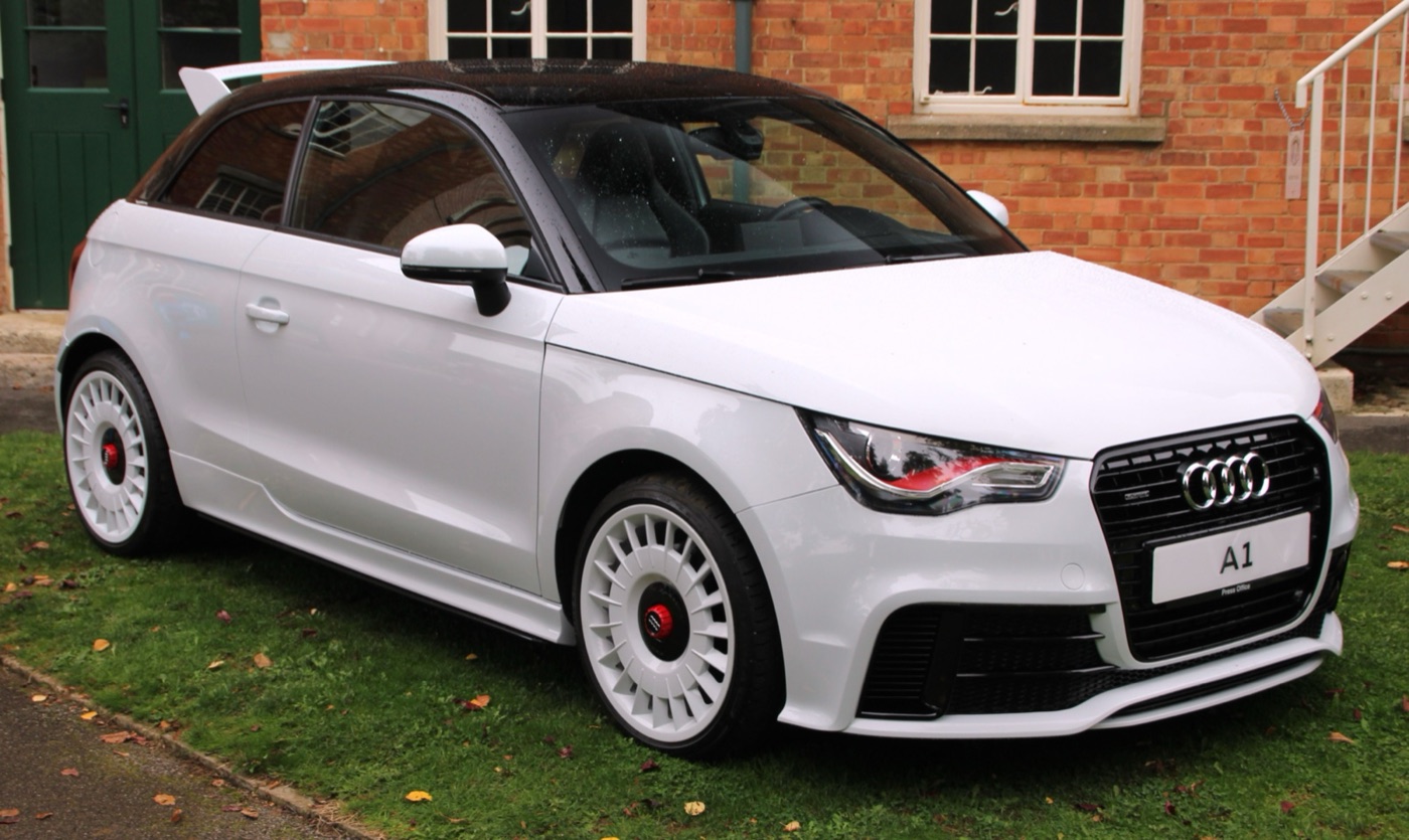 White Audi A1 quattro with black roof, white turbine-style wheels and a large roof spoiler