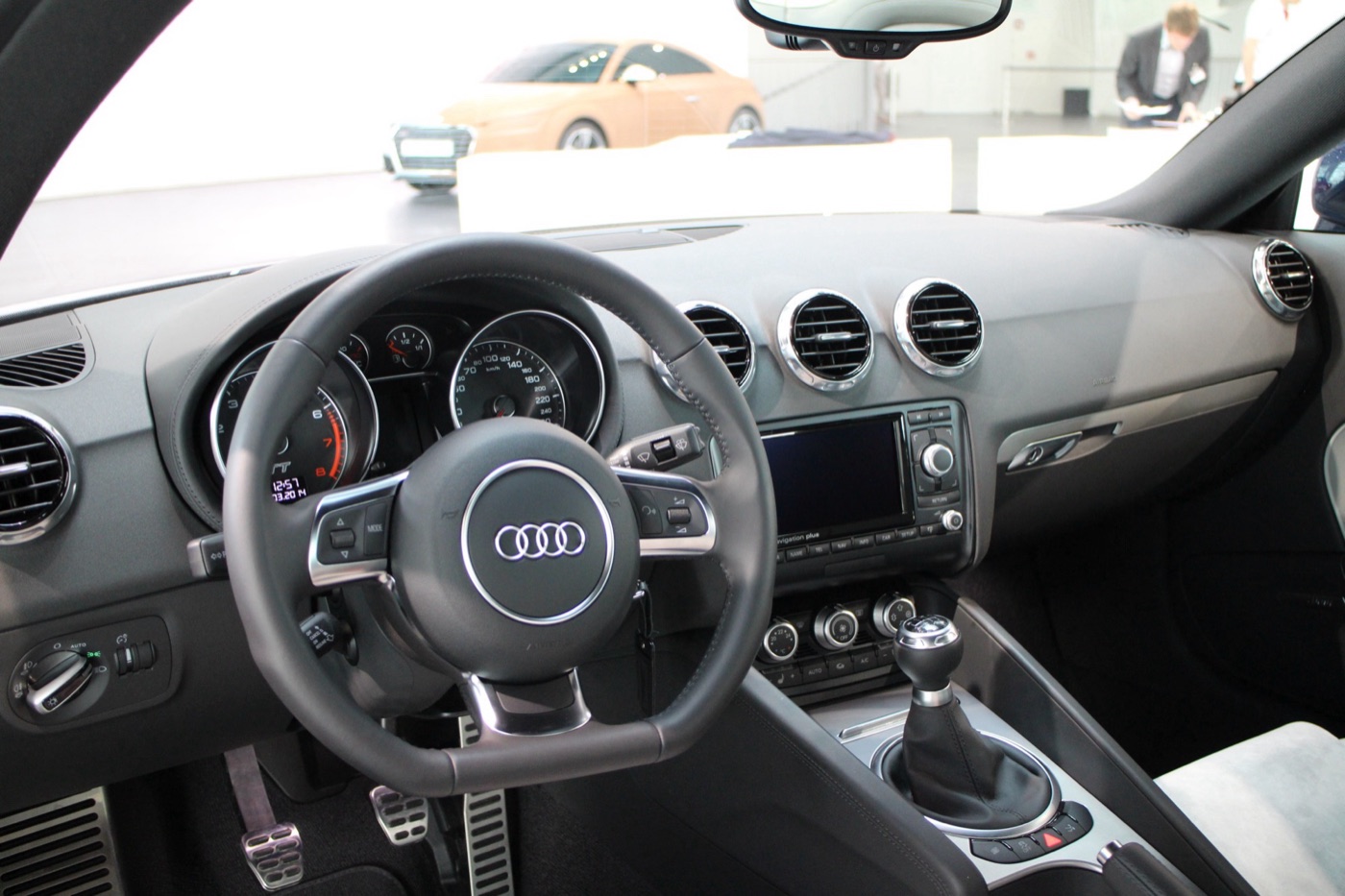Audi TT Mk2 dashboard with a flat-bottomed steering wheel, round air vents and a navigation screen