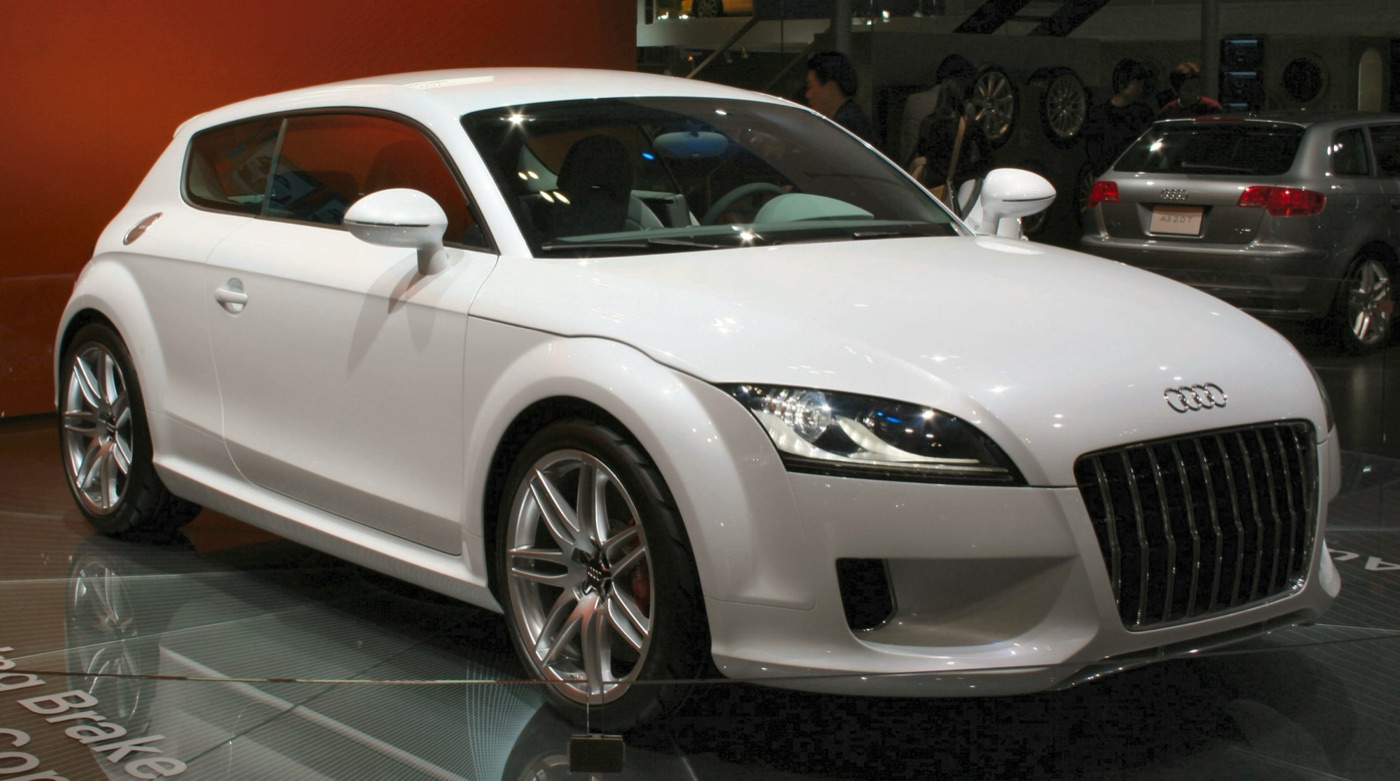 White Audi Shooting Brake concept, a two-door hatchback with TT-style headlamps, on a motor show stand