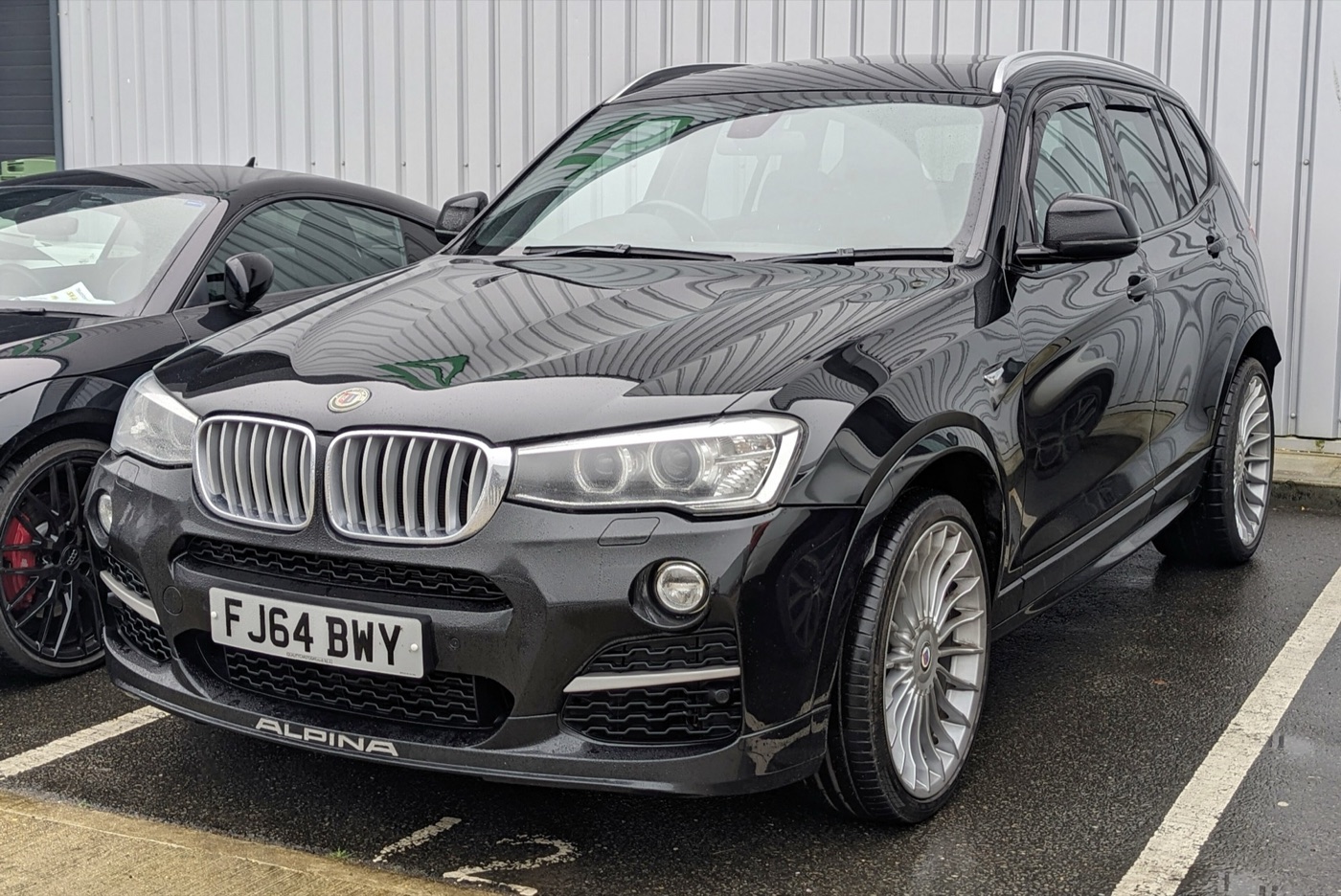Black Alpina XD3 BiTurbo based on the facelifted BMW X3 F25 with Alpina front spoiler and multi-spoke wheels