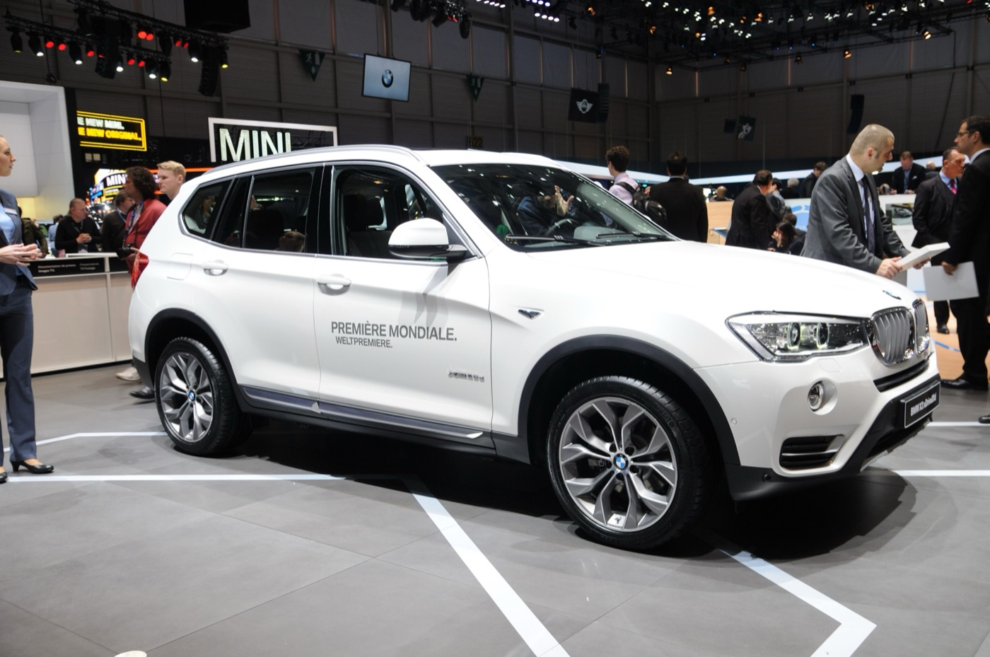 White facelifted BMW X3 xDrive20d with world premiere lettering on its doors on the BMW stand at the 2014 Geneva motor show