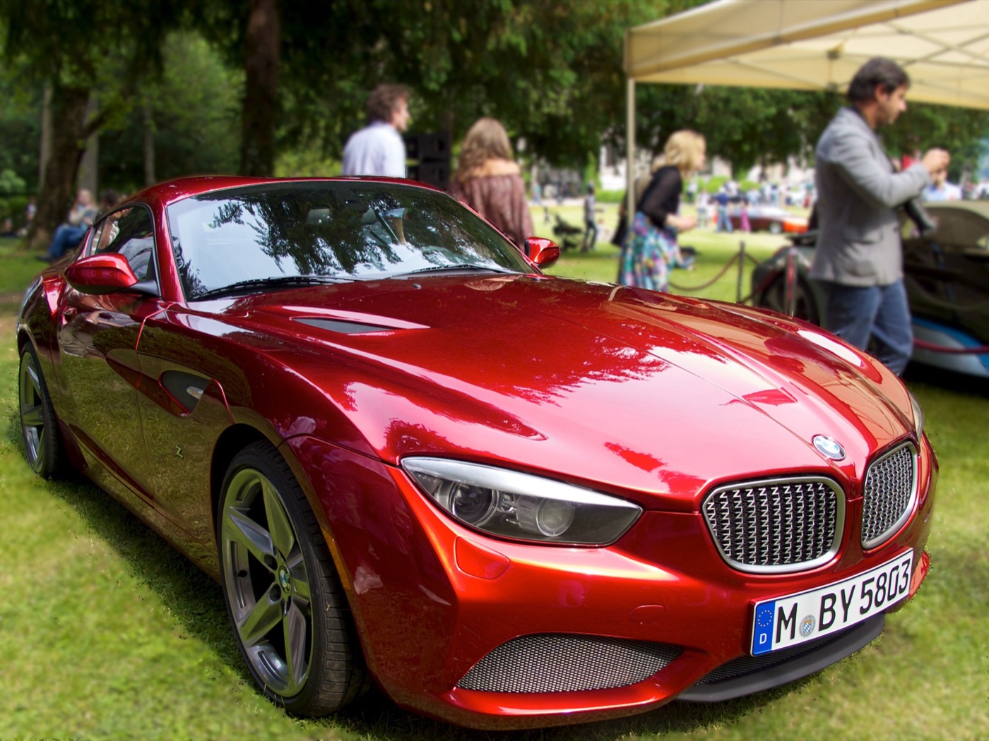 Deep red BMW Zagato Coupé with a mesh kidney grille, on the lawn at a concours