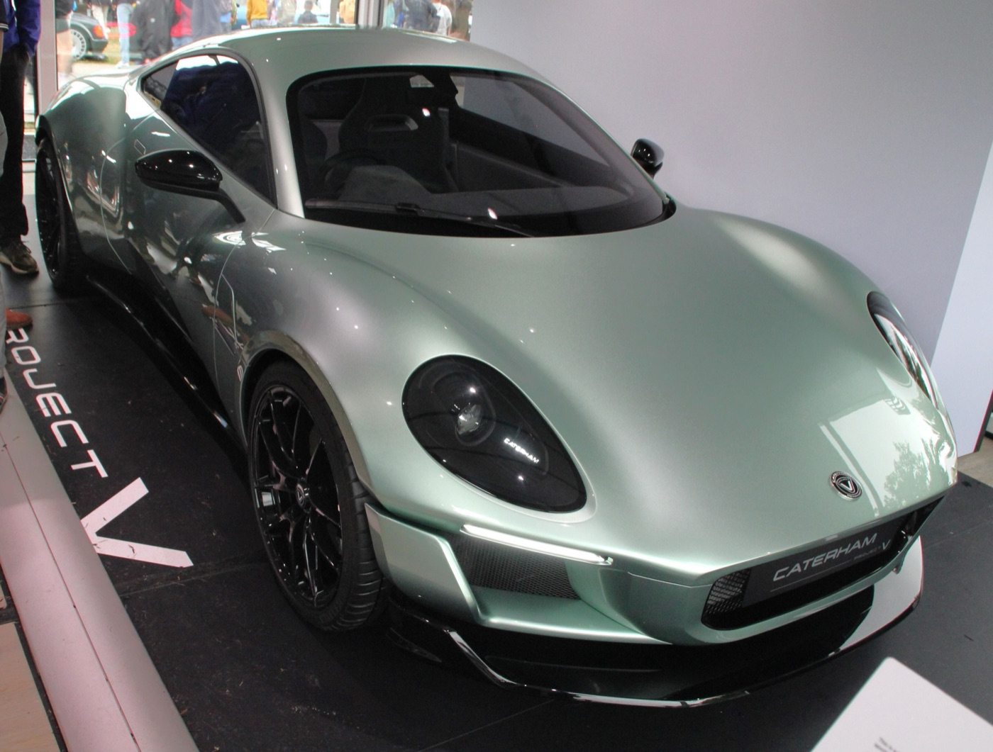 Pale green Caterham Project V electric coupé concept on a display stand