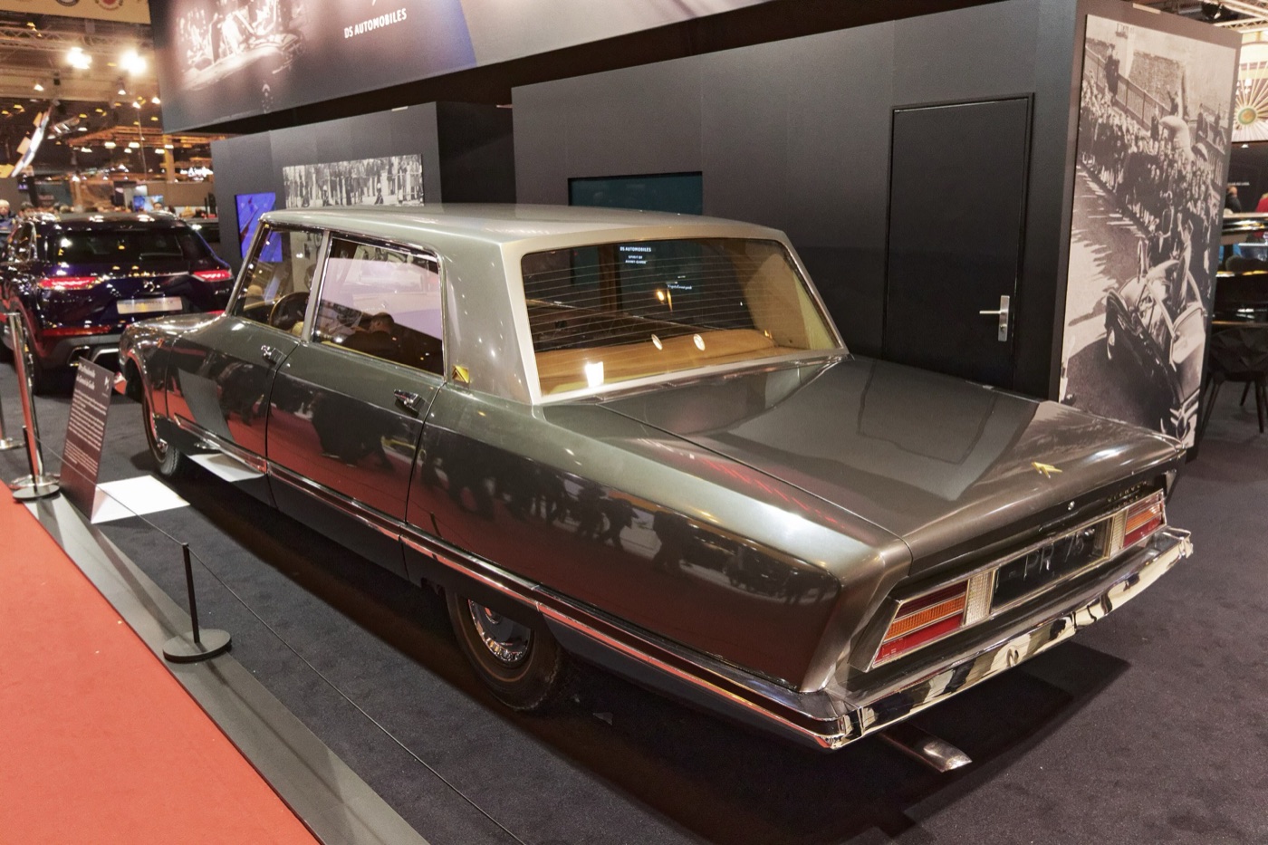Grey Citroën DS Présidentielle of 1968, a long four-door saloon with a squared-off roof, on the DS Automobiles stand at Rétromobile