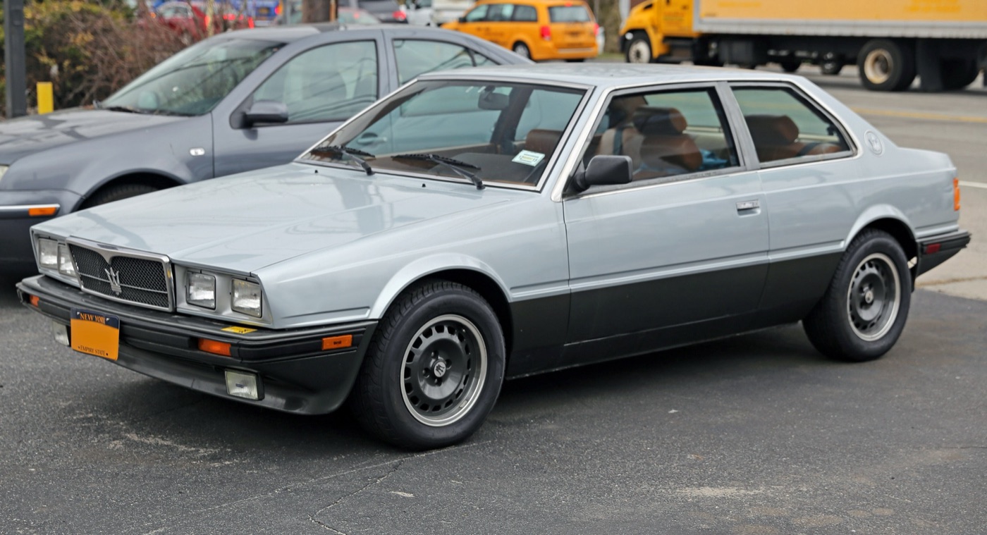 Silver and black Maserati Biturbo E two-door coupé parked in a car park in New York