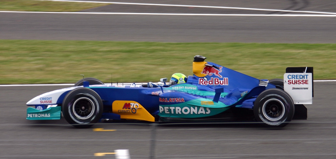 Blue and white Sauber C23 Formula One car with Petronas and Red Bull logos, Felipe Massa at the wheel, on the track at Silverstone