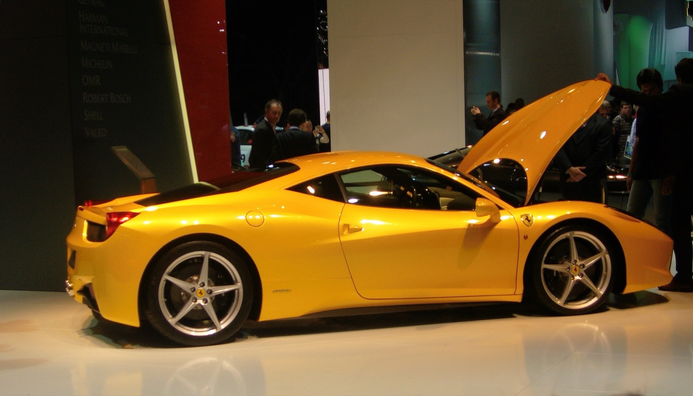 Yellow Ferrari 458 Italia in profile with its front lid open on the Ferrari stand at the Frankfurt motor show