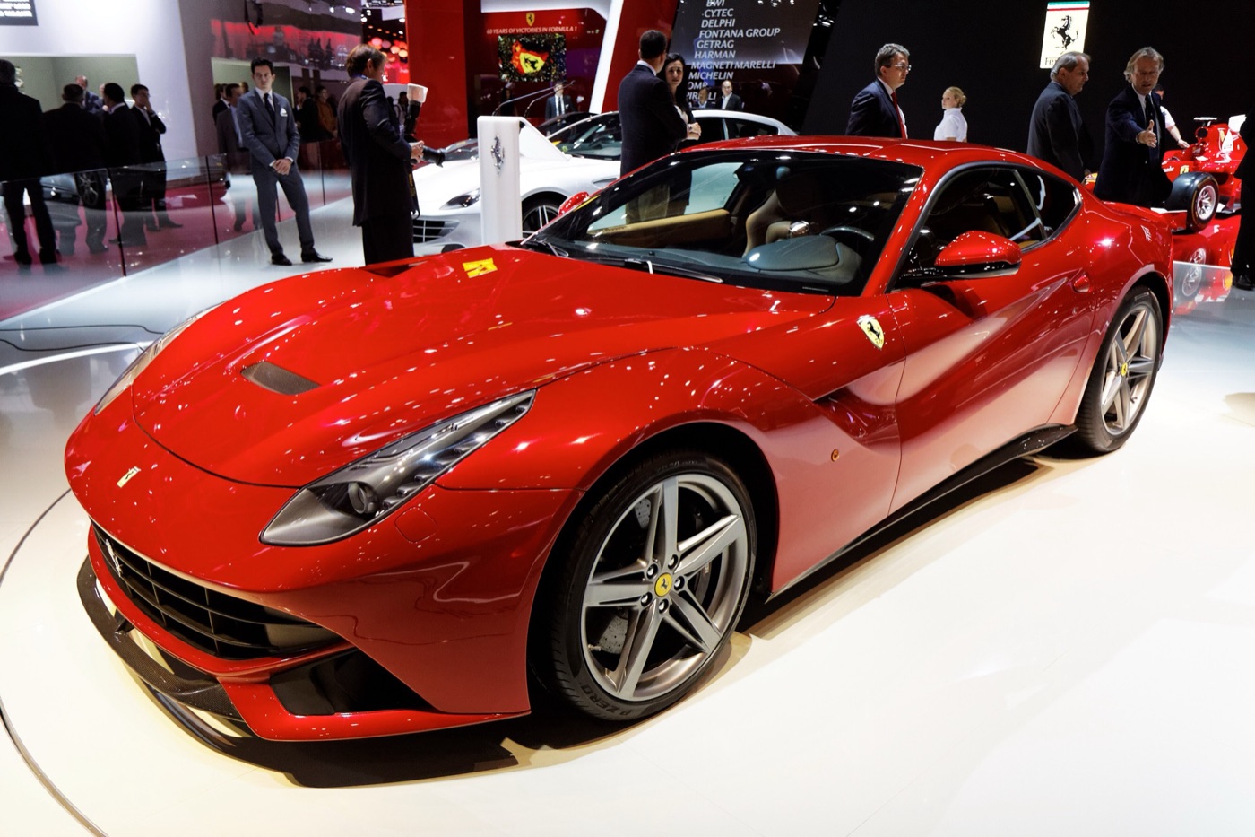 Red Ferrari F12berlinetta on a motor show stand