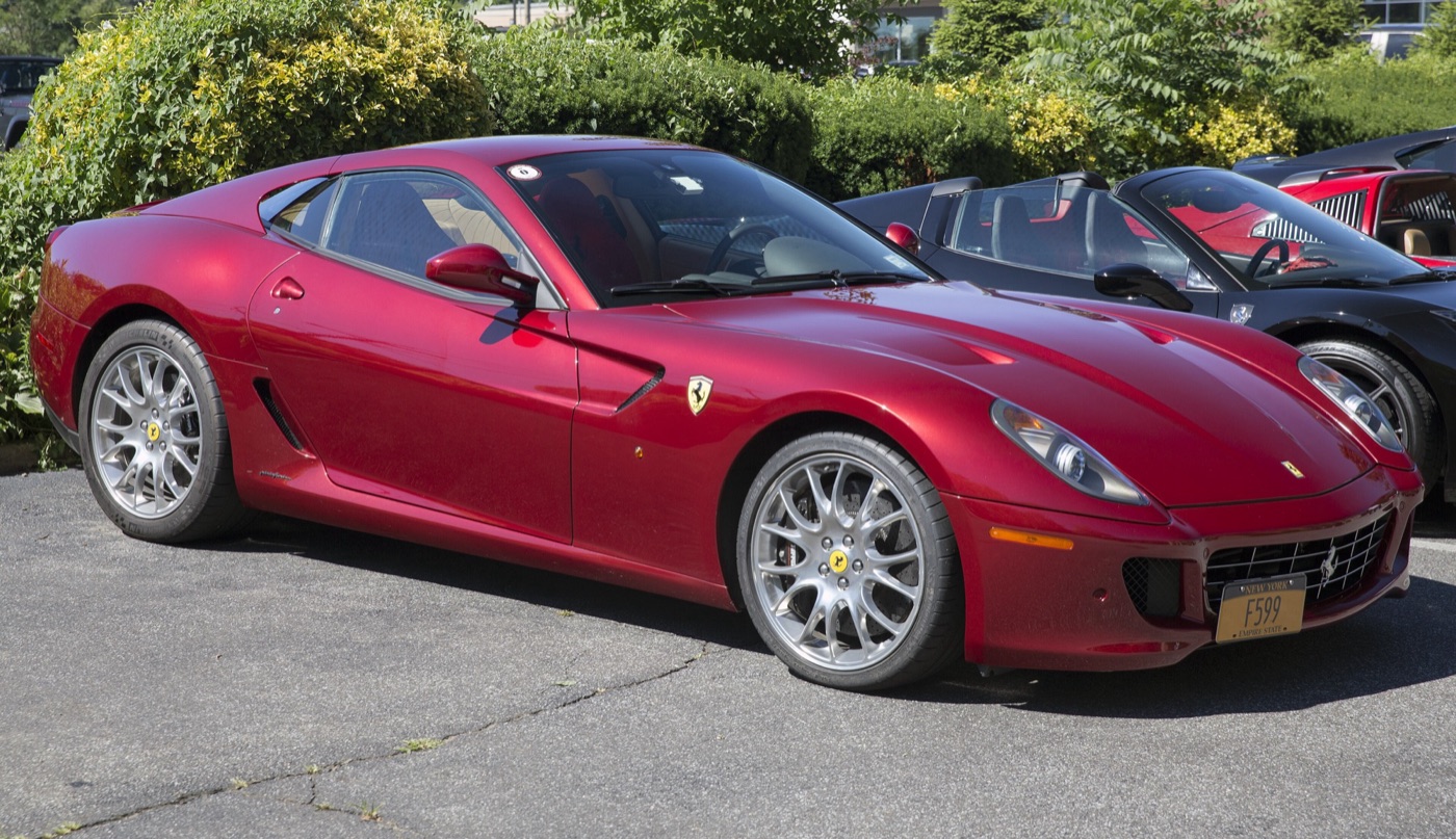 Dark red Ferrari 599 GTB Fiorano seen from the front right, parked in a car park