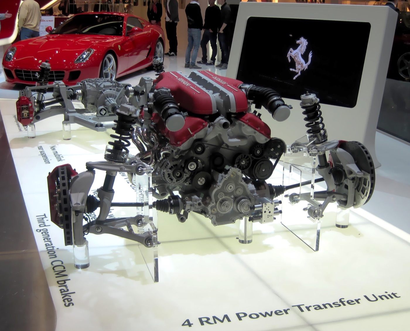 Cutaway display of the Ferrari FF V12 engine, front suspension and 4RM power transfer unit with carbon-ceramic brakes