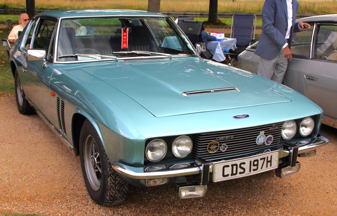 Pale blue 1970 Jensen FF with two vents in the front wing and an air intake on the bonnet