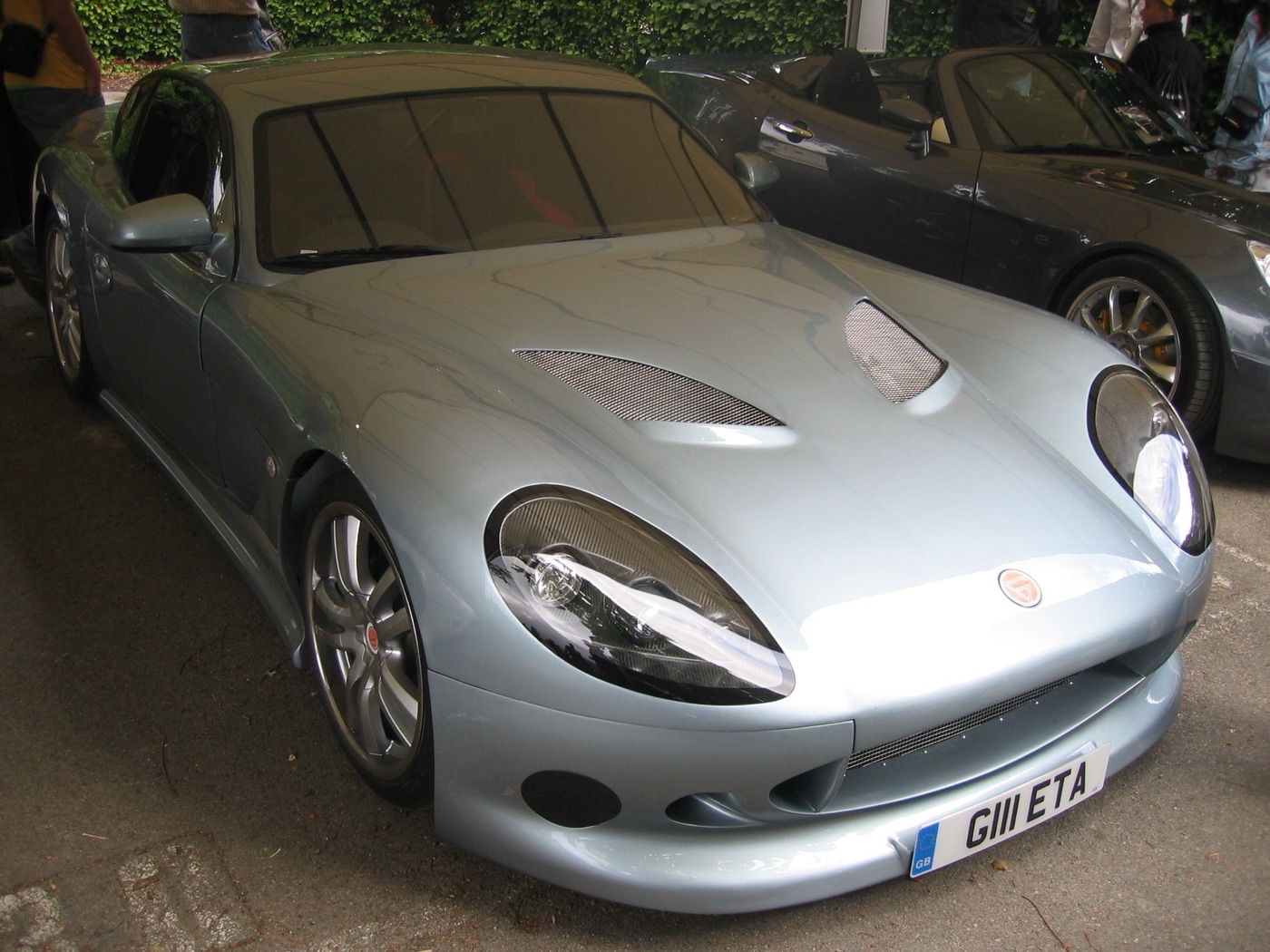 Silver-blue Ginetta G50 coupé with mesh bonnet vents and large oval headlamps