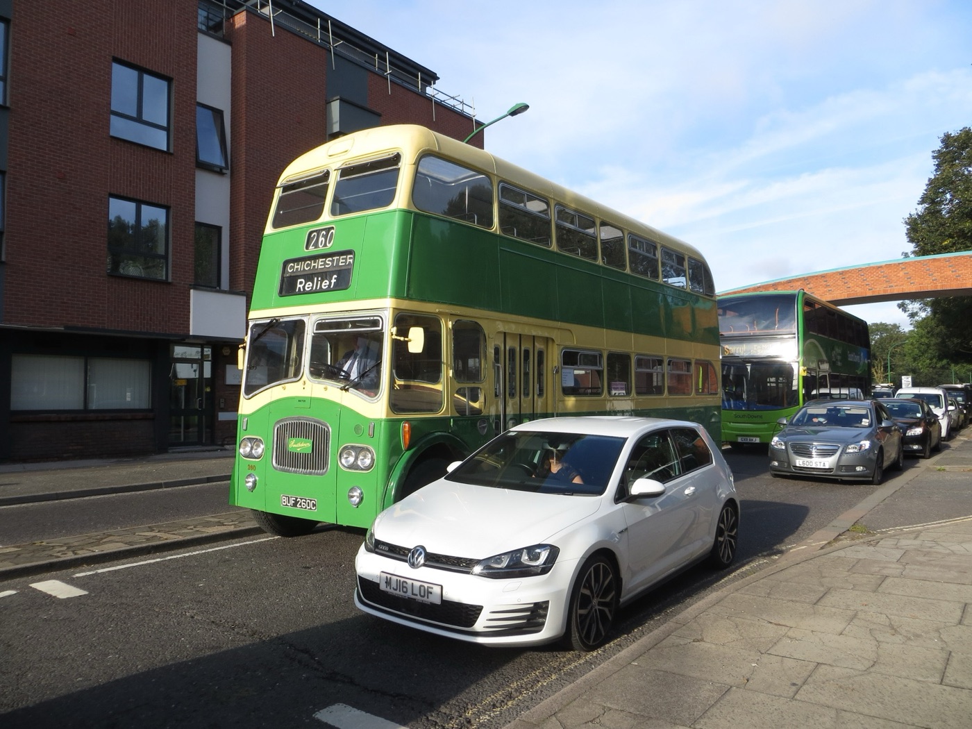 Green and cream Southdown double-decker bus showing Chichester Relief 260 on Avenue de Chartres, Chichester, with modern cars beside it