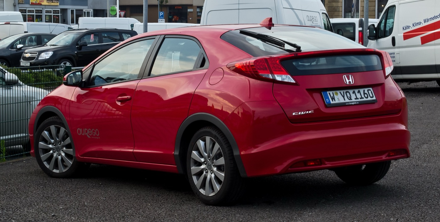 Rear of a red 2012 Honda Civic 2.2 i-DTEC hatchback showing the split rear window, rear wiper and light bar
