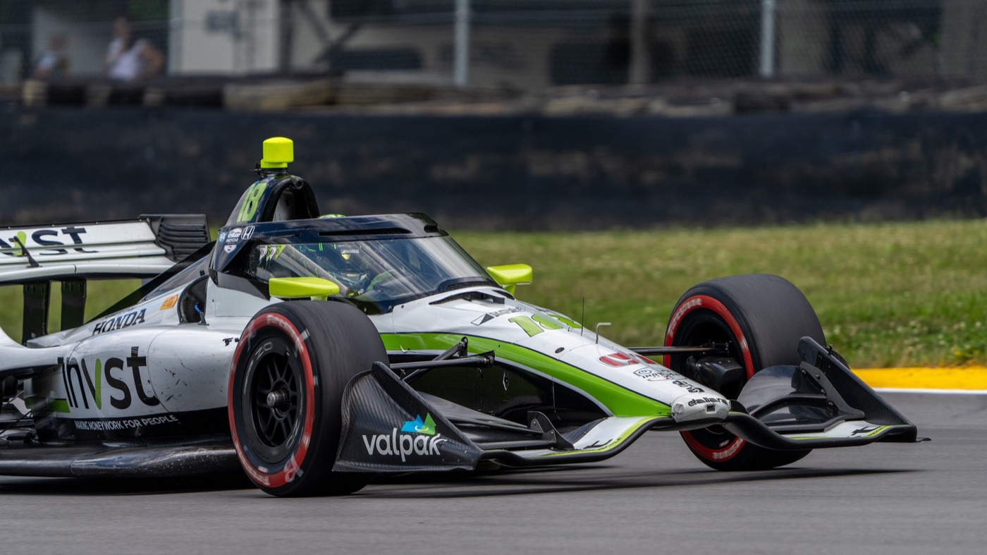 Jack Harvey’s white No. 18 Dale Coyne Racing Honda with green INVST livery on track at Mid-Ohio