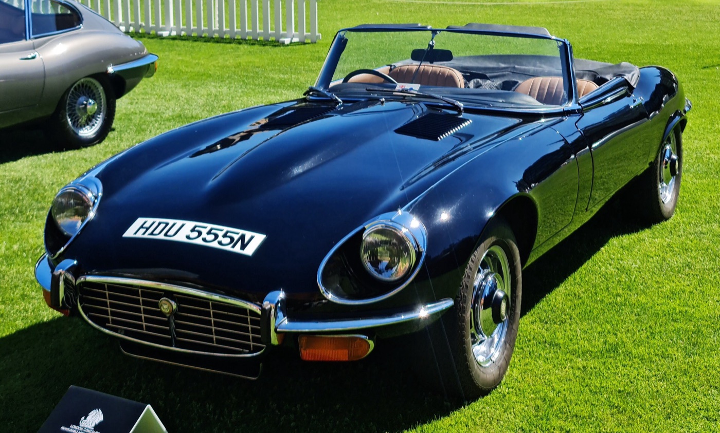 Black Series 3 V12 E-Type roadster with the registration HDU 555N on grass at a concours