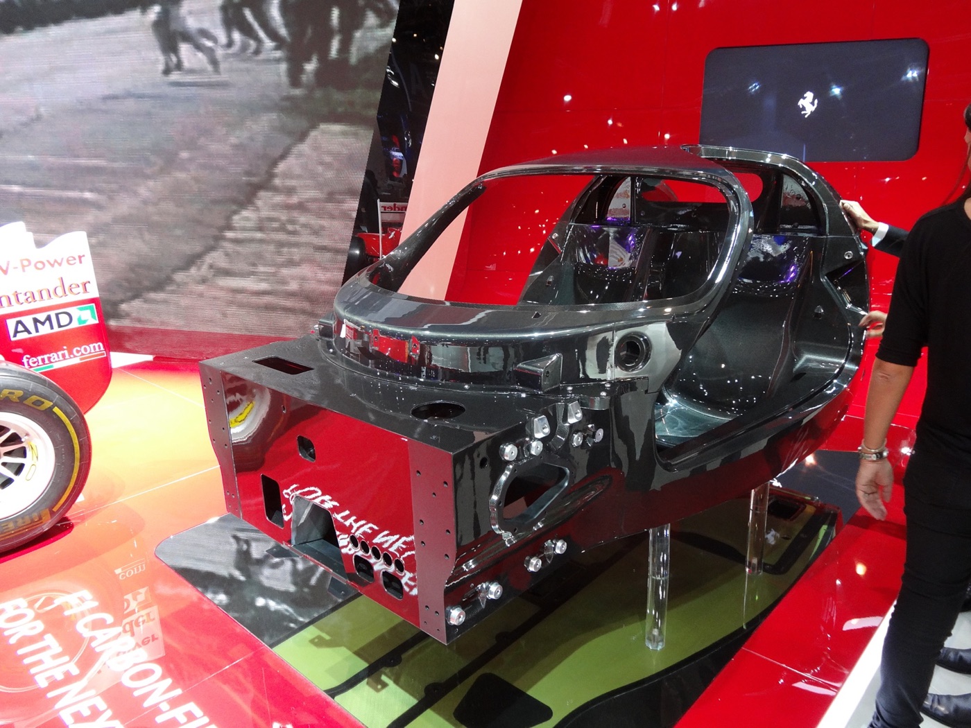 Bare carbon-fibre monocoque of the car that became the LaFerrari, on a stand at the Paris motor show
