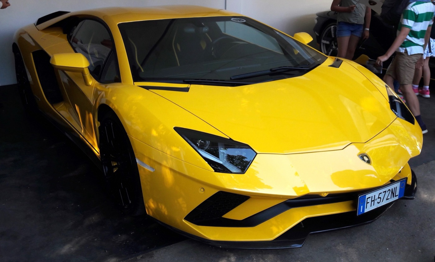 Yellow Lamborghini Aventador S coupé parked at the Goodwood Festival of Speed, seen from the front three-quarter