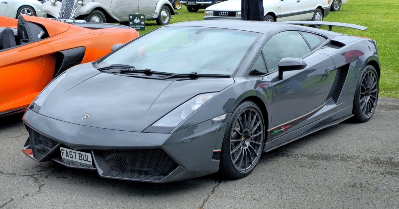 Grey Lamborghini Gallardo Superleggera with dark wheels, a rear wing and tricolour stripes along the sill