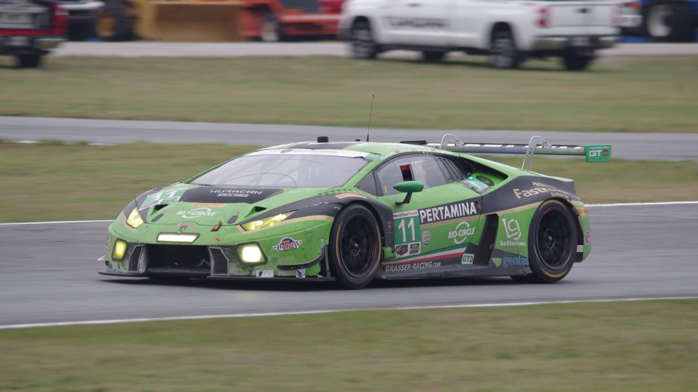 Green Grasser Racing Lamborghini Huracán GT3 number 11 racing on a damp track