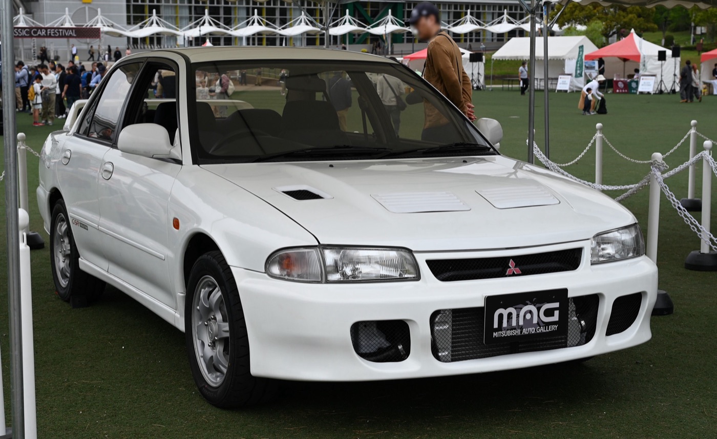 White 1992 Mitsubishi Lancer GSR Evolution, the first Evo, on show at a classic car festival in Japan