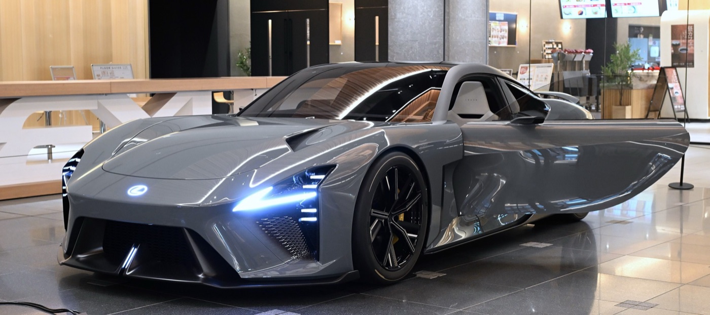Grey Lexus LFA Concept electric coupé with its driver