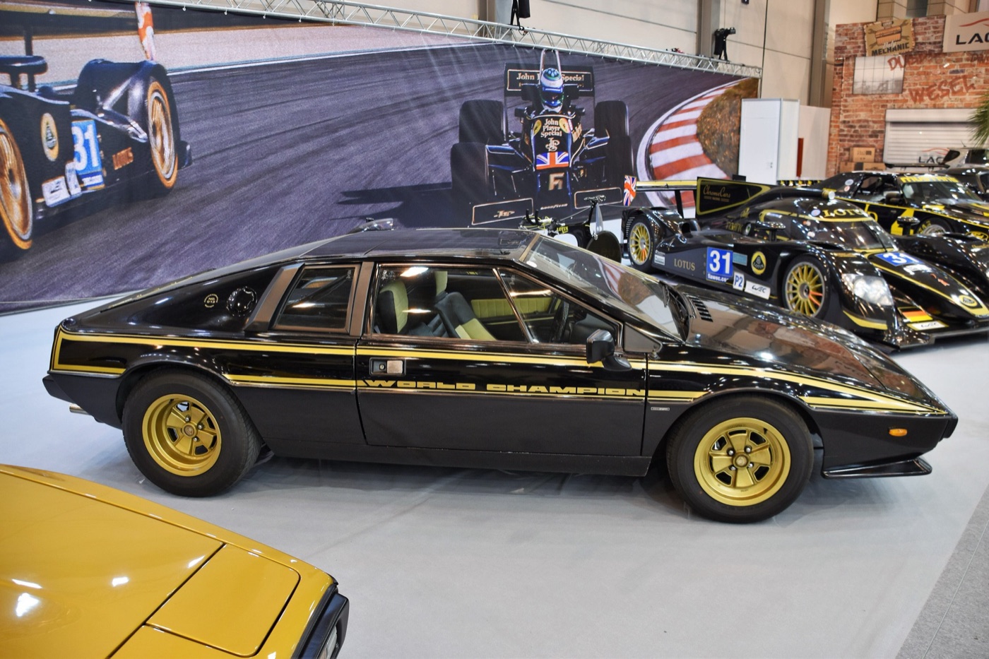 Black Lotus Esprit S2 with gold pinstripes, gold wheels and World Champion lettering on the door