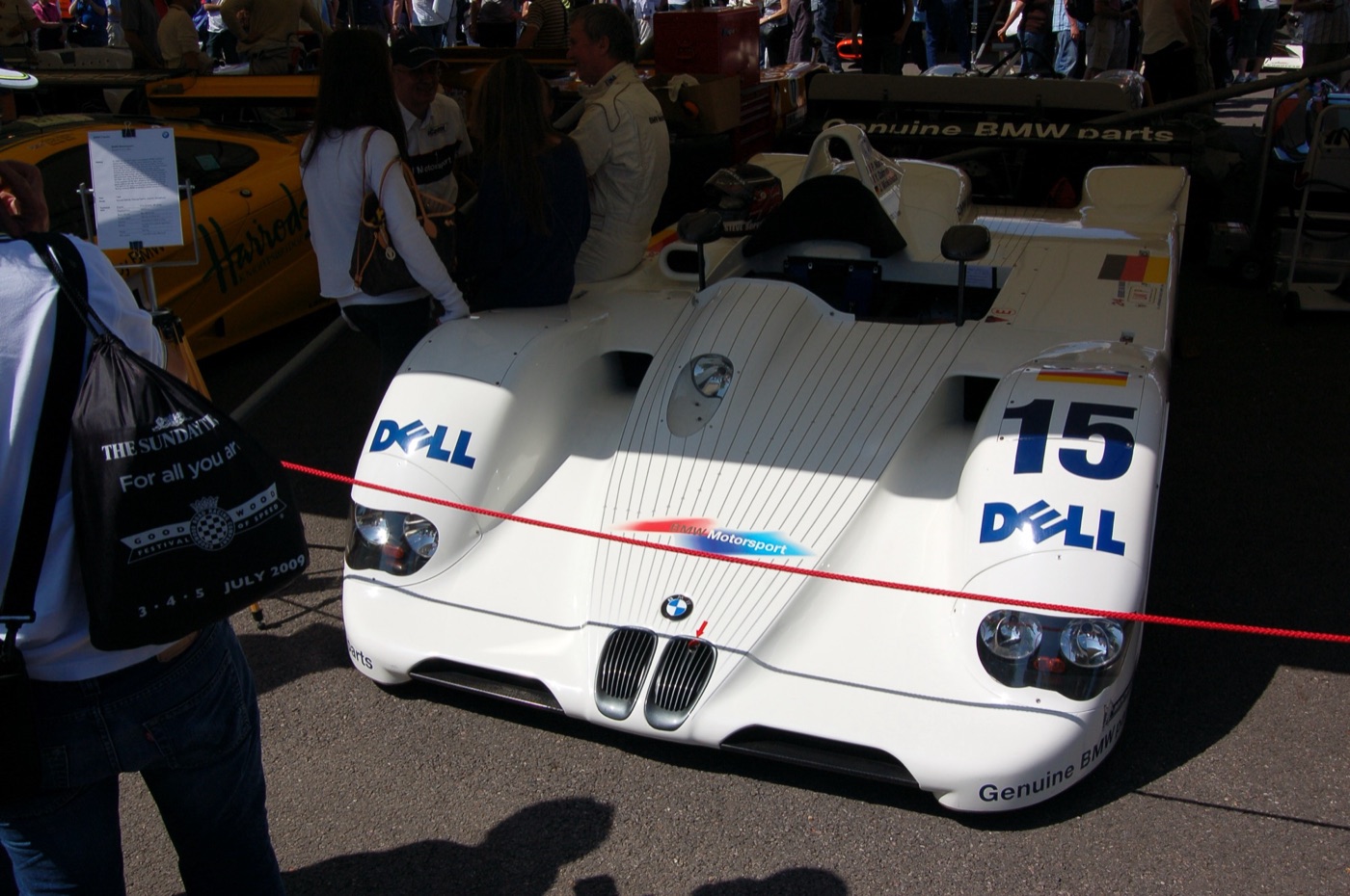 White BMW V12 LMR open-top prototype, number 15, with Dell logos and a BMW Motorsport badge on the nose, behind a red rope