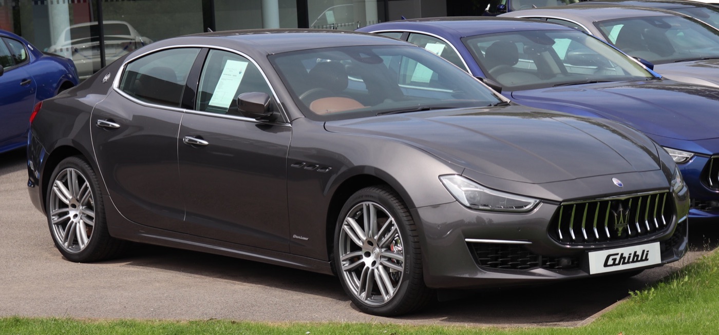 Dark grey 2018 Maserati Ghibli GranLusso diesel on a dealer forecourt, front three-quarter view showing the restyled grille and LED headlamps