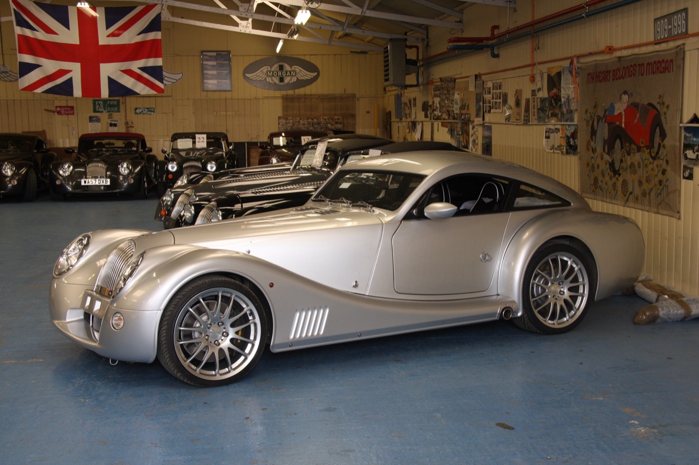 Silver Morgan AeroMax parked among customer Morgans awaiting despatch in a shed at the Malvern Link works