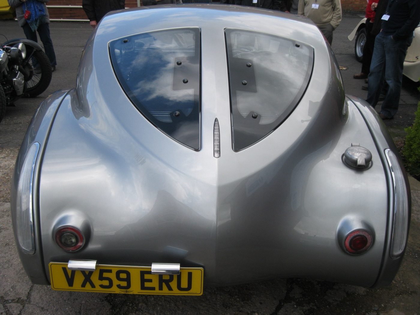 Rear of a silver Morgan AeroMax showing the two glass rear windows split by a central spine and the boat-tail shape