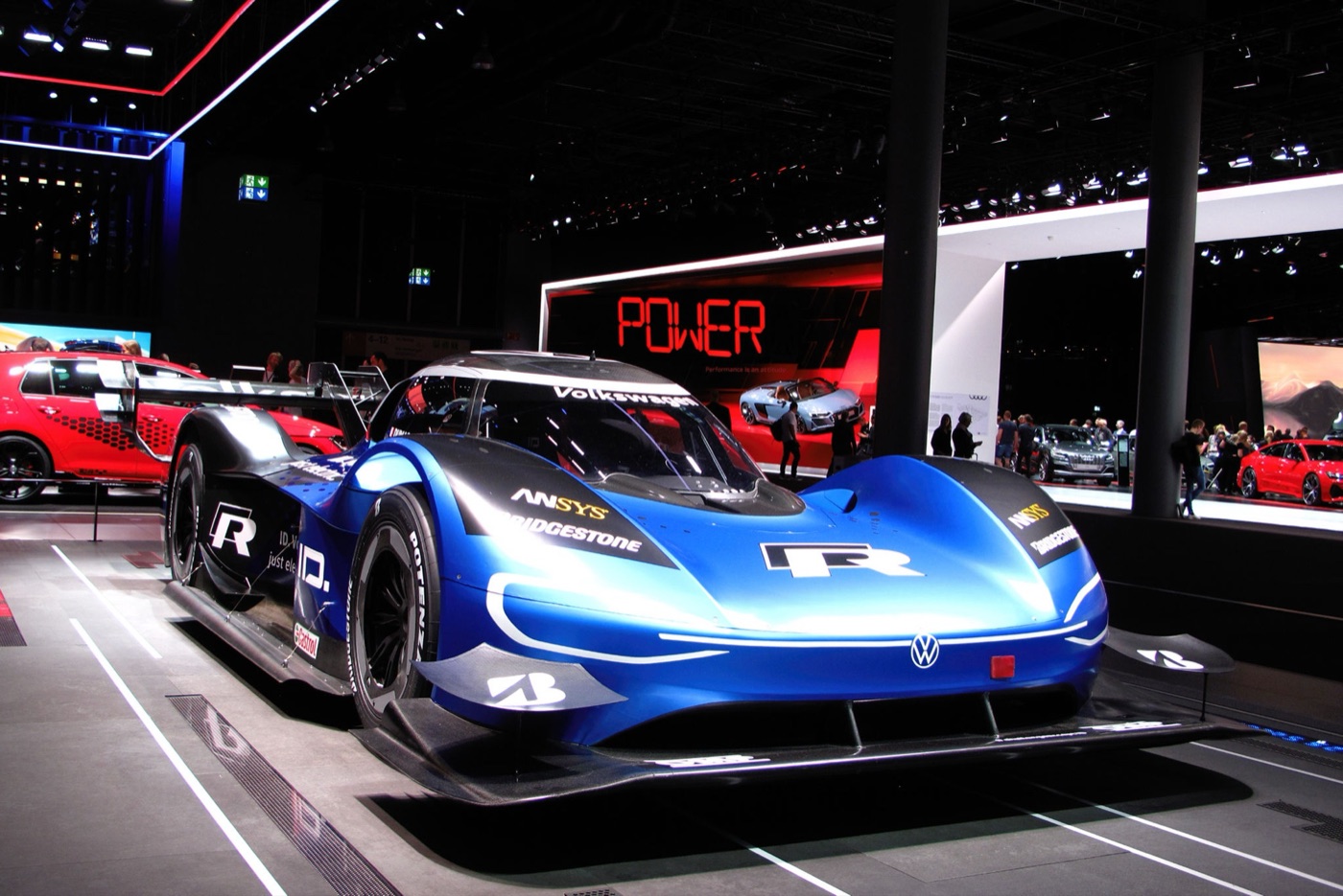 Blue and black Volkswagen I.D. R electric prototype on a motor show stand
