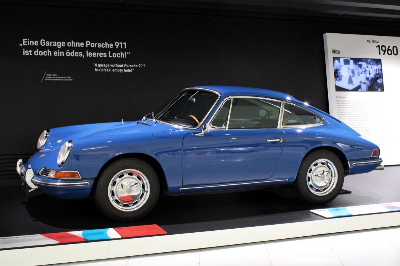 Blue early Porsche 911 2.0 coupé in profile at the Porsche Museum in Stuttgart