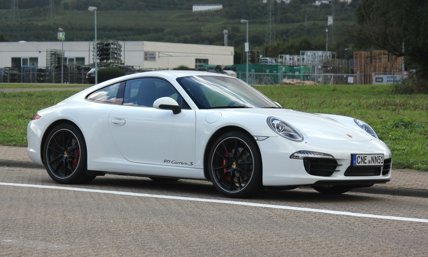 White 2013 Porsche 911 Carrera S of the 991 generation with black wheels and red brake callipers