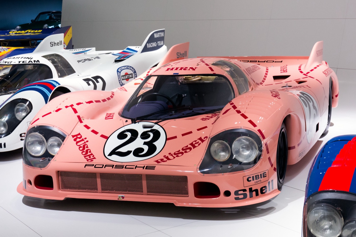 Pink Porsche 917/20 number 23 with butcher-chart lines and German meat-cut names on its body