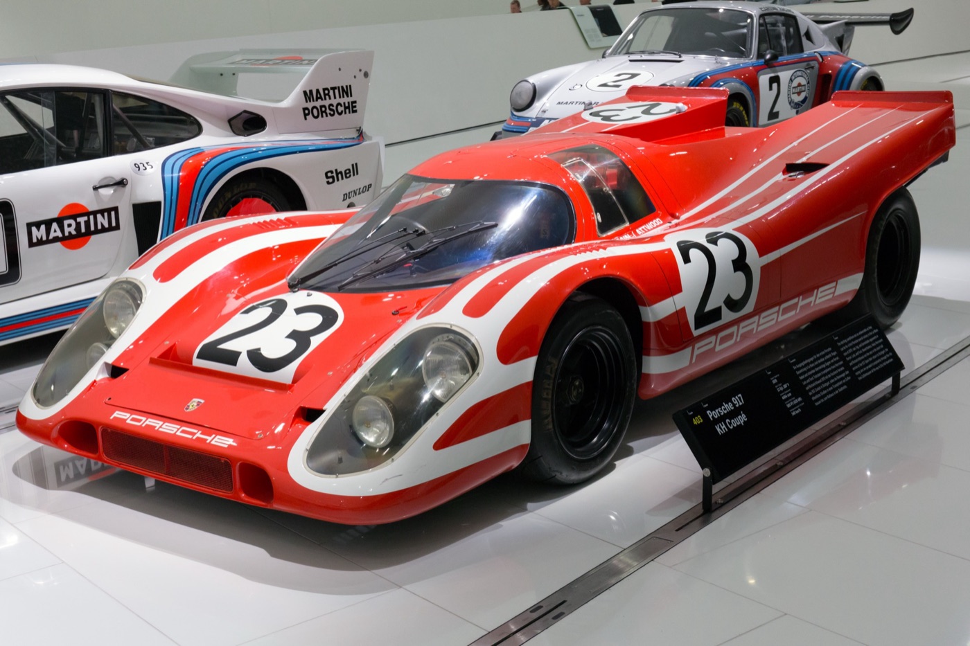 Red and white Porsche 917K number 23, the 1970 Le Mans winner, on display at the Porsche Museum