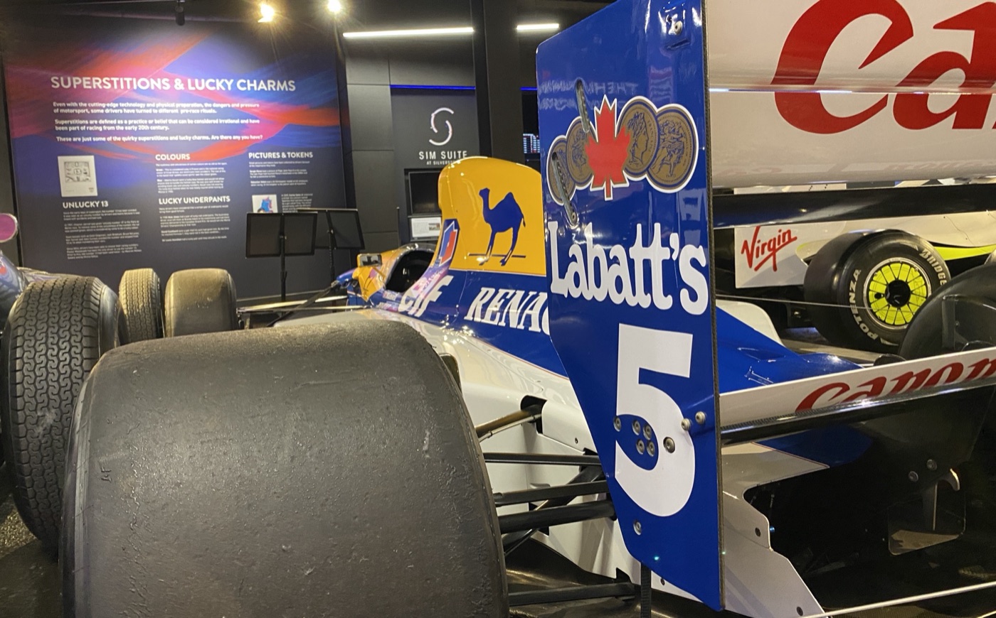 The rear wing and tyres of Nigel Mansell’s blue, white and yellow Williams FW14B number 5 on display in Silverstone Museum