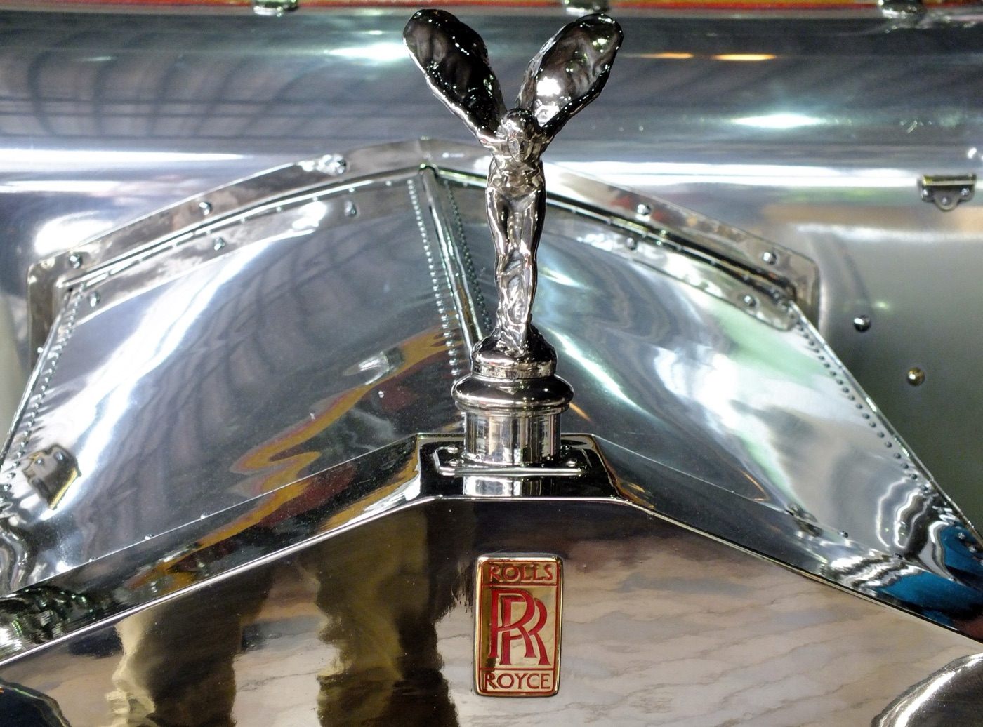 Tall early Spirit of Ecstasy on the polished radiator and riveted bonnet of a Rolls-Royce Silver Ghost