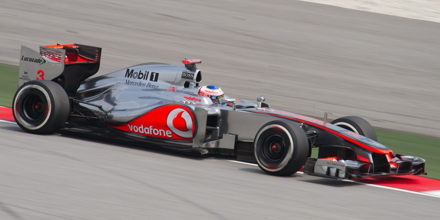 Jenson Button driving the silver and red Vodafone McLaren MP4-27 number 3 in practice at Sepang