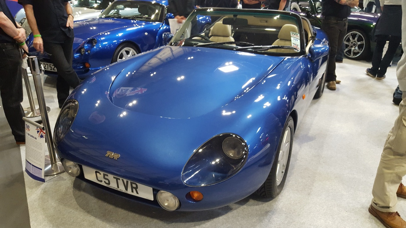 Blue TVR Griffith 500 roadster with a C5 TVR number plate on a club stand at a classic car show