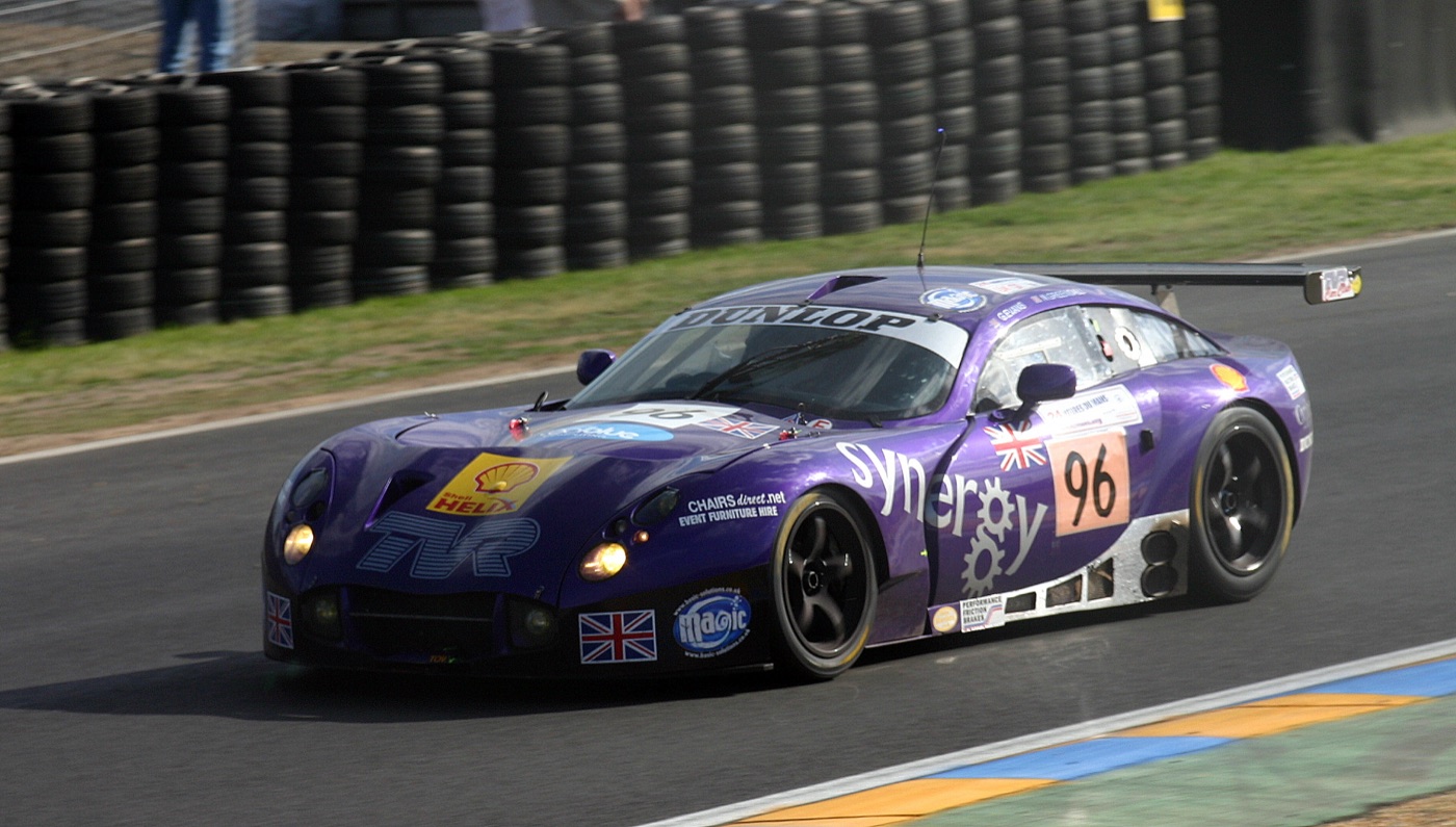 Purple Synergy-liveried TVR Tuscan T400R racing car number 96 approaching the Dunlop Bridge at Le Mans