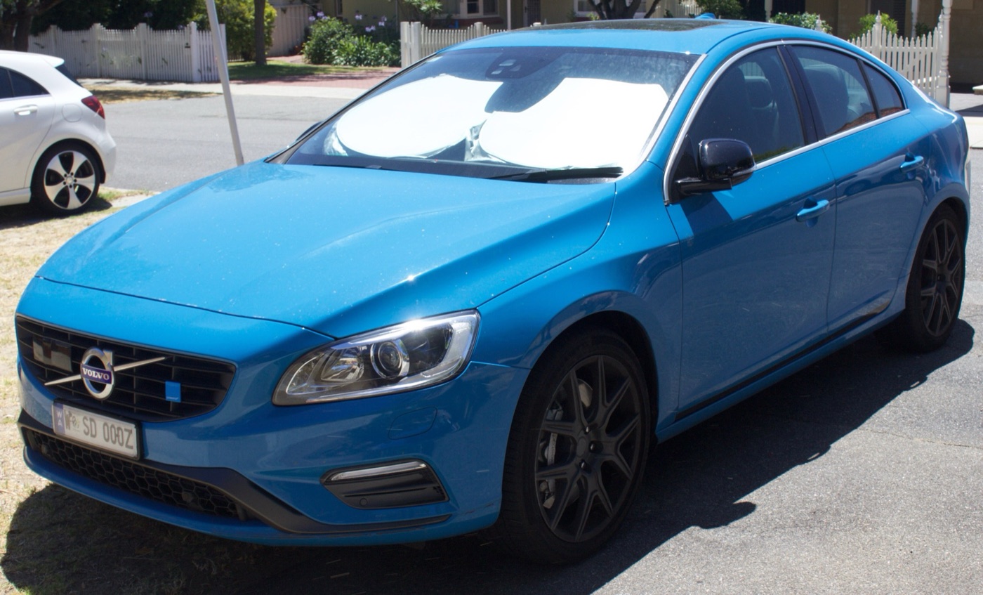 Rebel Blue 2013 Volvo S60 Polestar saloon with black wheels and Australian number plate, parked on a driveway