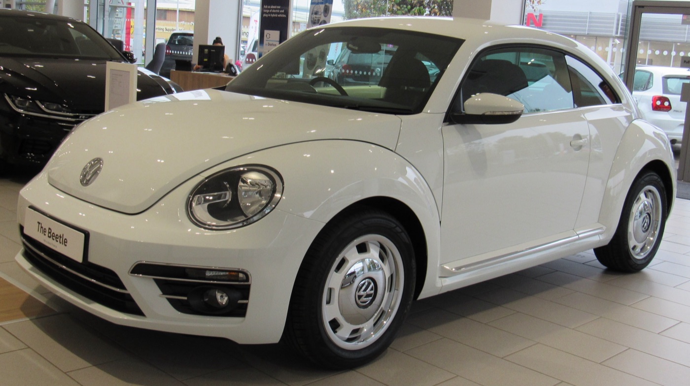White 2017 Volkswagen Beetle Design with retro-style wheel trims in a British showroom