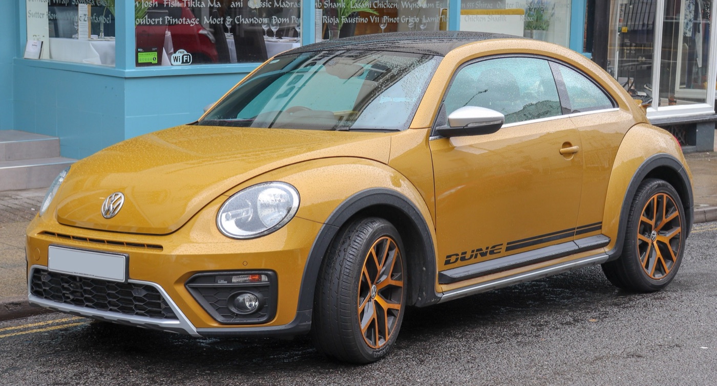 Gold Volkswagen Beetle Dune with black plastic wheel-arch trims and Dune lettering on the sill